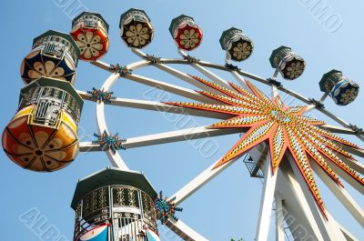 Ferris wheel against blue sky