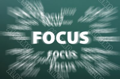 Focus word with motion rays on green chalkboard background 