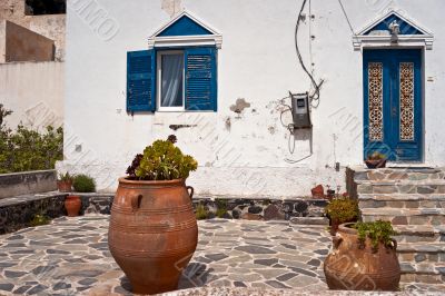 Old house yard with gardenpot Old house yard with gardenpot