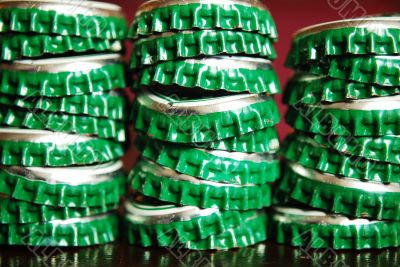 pile of green beer caps pile of green beer caps