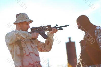 soldier aiming terrorist