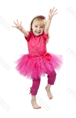 little girl in a pink dress dancing in studio