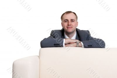 businessman looking out over the sofa
