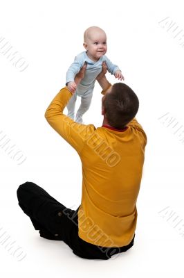 Dad tosses baby
