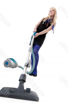 Girl with a vacuum cleaner