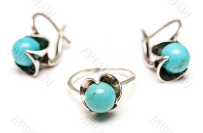 set of silver earrings and a ring