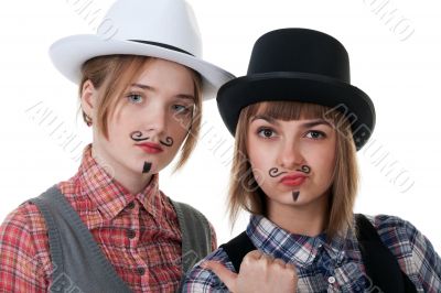 Two girls with painted mustaches