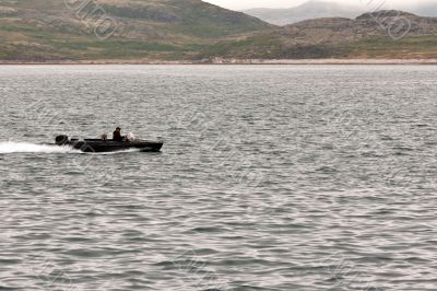 Motor boat rides around the bay in the Barents Sea.