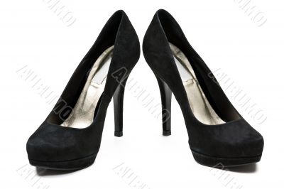 pair of black suede women`s high heel shoes