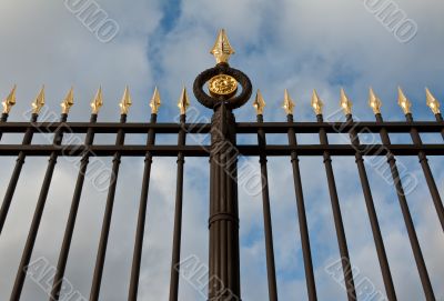 steel fence with gold spears