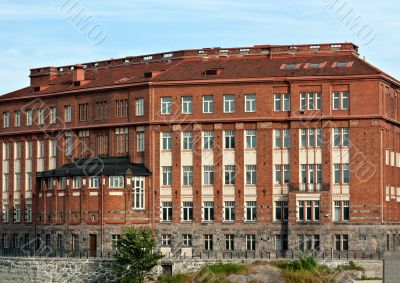Gloomy building of red brick