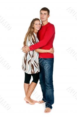 girl hugging a guy in a red dress in the studio