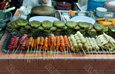 Asian street food tray with skewers