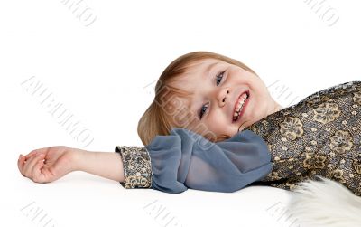 little girl lying on the floor in the studio