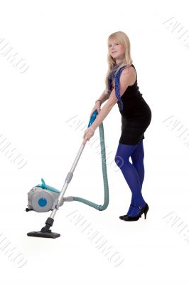 The girl in blue tights with a vacuum cleaner