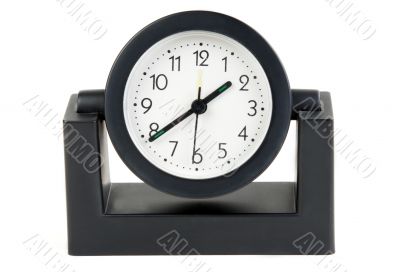 Desktops mechanical clock in a black plastic casing