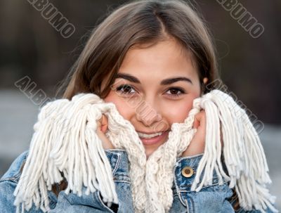 portrait of a girl wrapped in a warm scarf