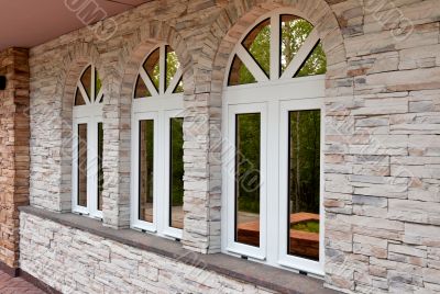 Three windows in the stone wall