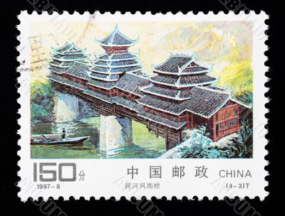 CHINA - CIRCA 1997: A Stamp printed in China shows a traditional covered bridge, circa 1997