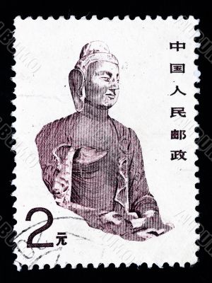 CHINA - CIRCA 1988 : A Stamp printed in China shows a buddha statue in a cave, circa 1988 CHINA - CIRCA 1988 : A Stamp printed in China shows a buddha statue in a cave, circa 1988