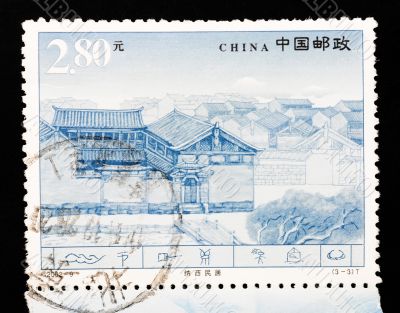 CHINA - CIRCA 2002: A Stamp printed in China shows the famous Naxi dwellings in Lijiang Yunnan, circa 2002