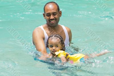Teaching baby girl how to swim