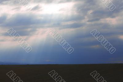 Dramatic sky and rays falling through the clouds