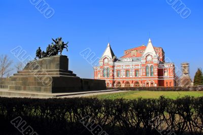 Landscape with historic theater and blue sky