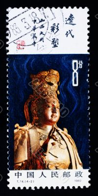 A stamp printed in China shows the ancient buddha statue