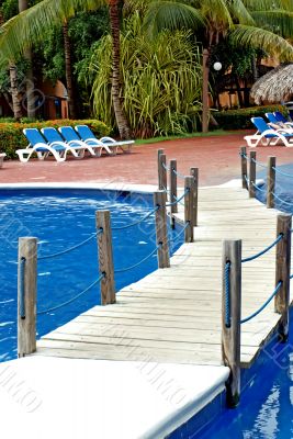 bridge over the pool and chairs