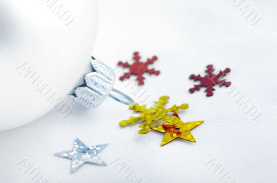 A silver christmas ball and snowflakes on a white background, ch