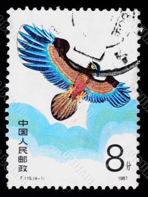 A stamp printed in China shows a kite of eagle figure  in the sky