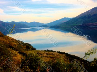 Tranquil Lake And Mountains