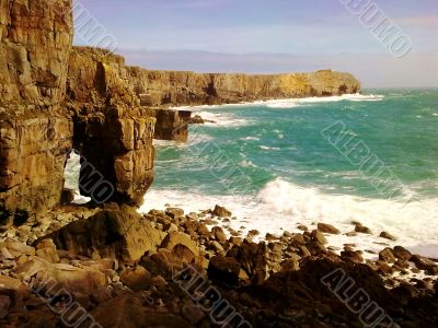 Rocky Shore And Breaking Waves