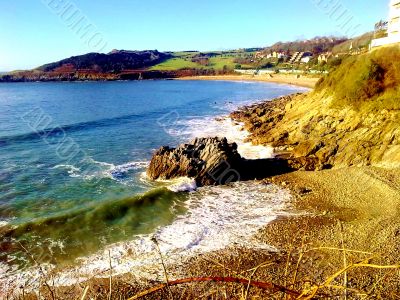 Surf Breaking Near Rocks