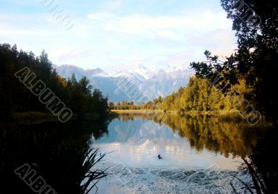 Ripples In Beautiful Lake With Mountains