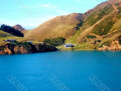 House On Edge Of Lake 