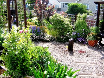 British Garden In Bloom With Water Feature