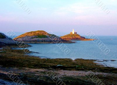 Lighthouse On The Rocks