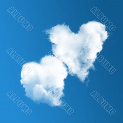 Two heart-shaped clouds on blue sky 