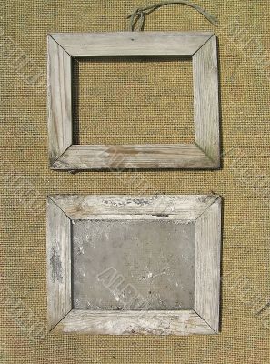 Two old wooden picture frame on the surface texture of burlap. T