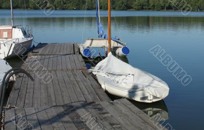 Boats by a  pier