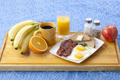 image of breakfast on wooden plank