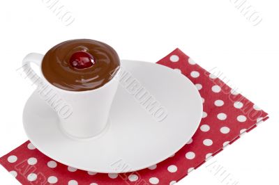 cup of chocolate on a plate with napkin