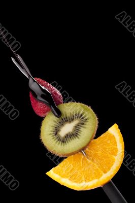 fruits in stick with chocolate dip