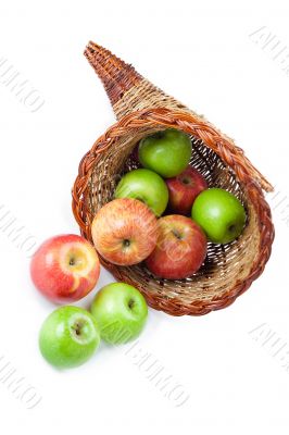 close up of apples and basket