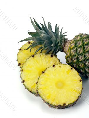 pineapple top and slices on white