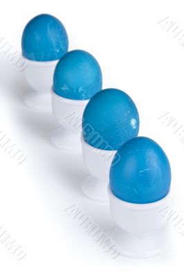  in lined blue eggs on a white cup
