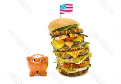 enormous burger falling over on piggy bank