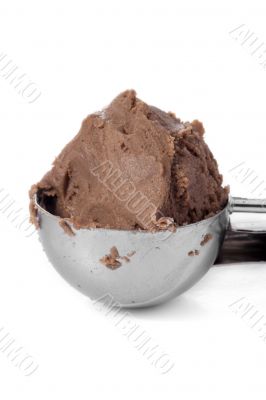 a scooper with chocolate ice cream